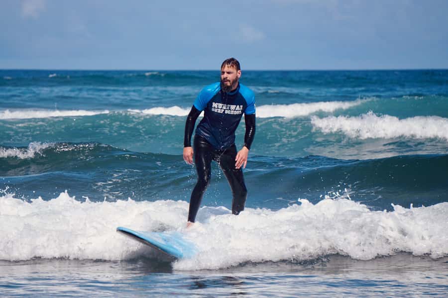 Auckland: Group Surfing Lesson with Muriwai Surf School - Gear and comfort: what you bring, and what they provide