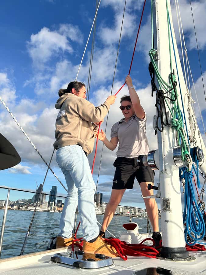 Auckland Harbour 1.5-Hour Sailing Cruise - Onboard comforts: ponchos, toilet access, and warm drinks