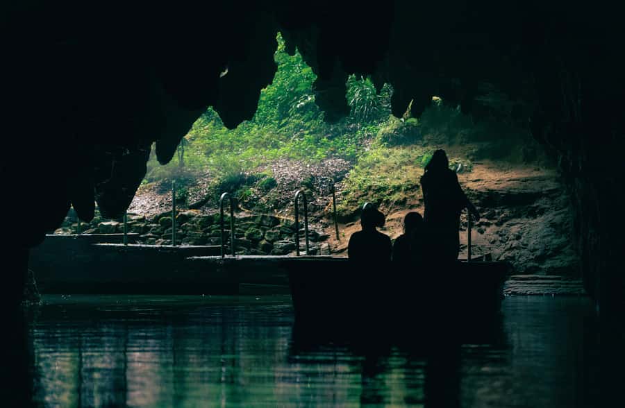 From Auckland: Rotorua Māori Village, Haka & Glowworm Caves - Waitomo Glowworm Caves: the boat ride under bioluminescent light