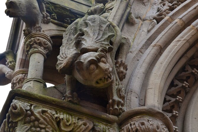 Heritage Dunedin City Walking Guided Tour - Queens Gardens to Princes Street: Scottish settlers, Kai Tahu welcome, and carved stone details
