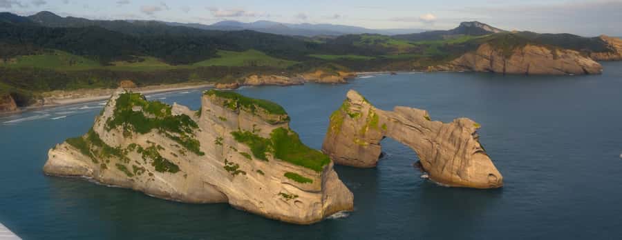 Takaka: Farewell Spit/Abel Tasman Scenic Flight - Wharariki and Pillar Point: Why They Circle These Landmarks